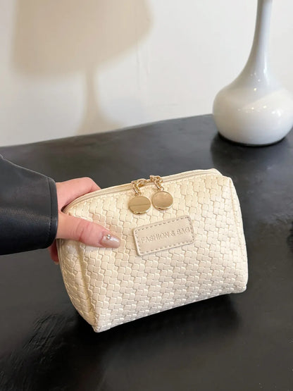 Bolso de paja trenzado con diseño hueco y correa para llevar bajo el brazo
