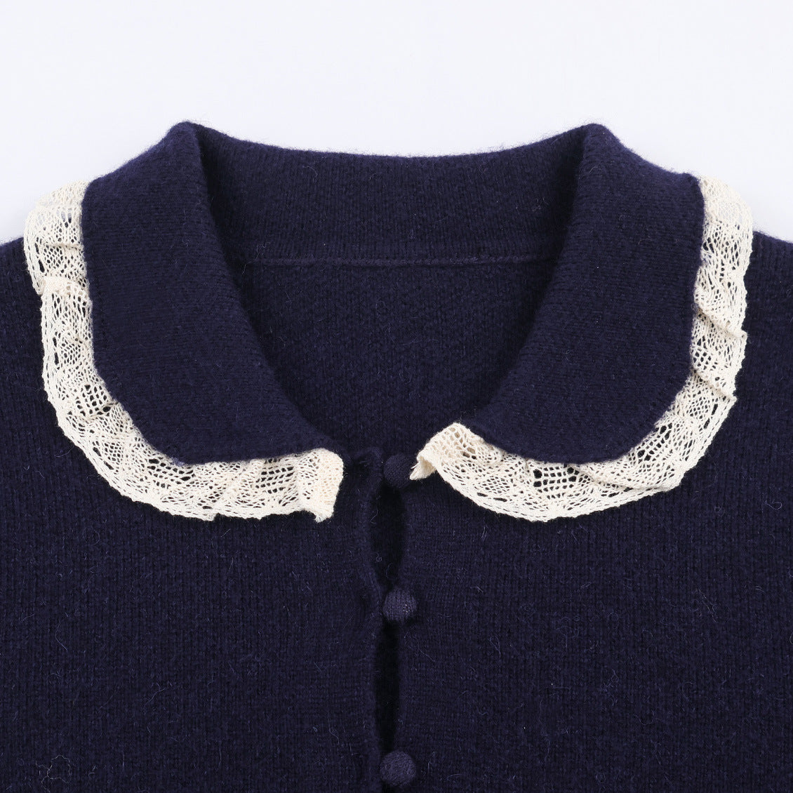 Chaqueta de punto con encaje y cuello redondo